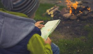 Child and camp fire