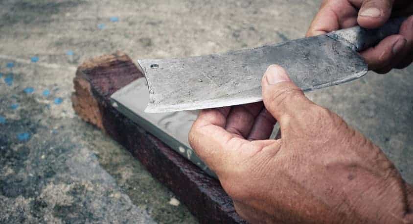 Sharpening knife on whetstone