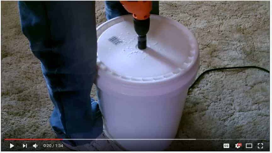 Drill a hole in the bucket lid