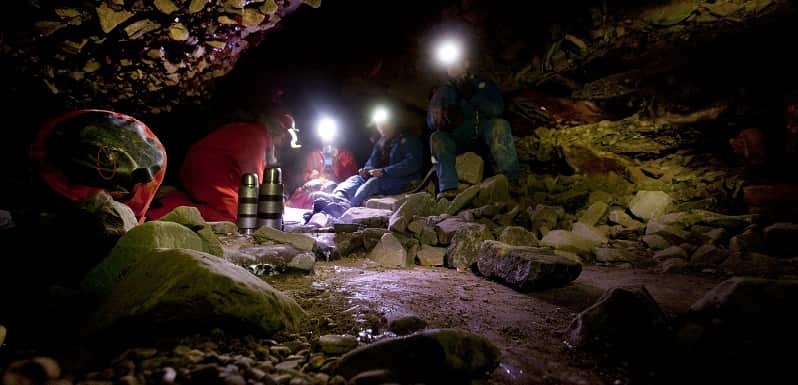 Spotlight beams in a cave