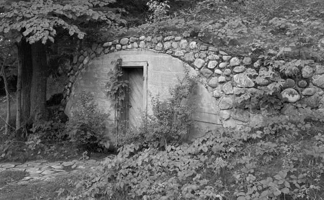 Outside of a root cellar built into a hill