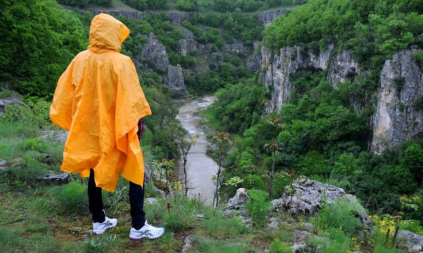 woman in ran poncho