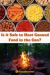 tins of canned food open and a camp fire
