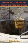 a bucket at the opening of a well