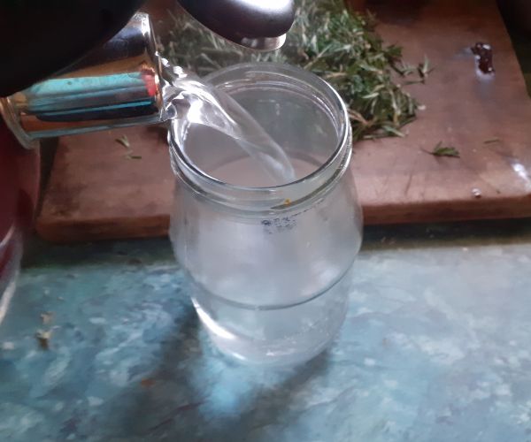 Sterilize jar with boiling water