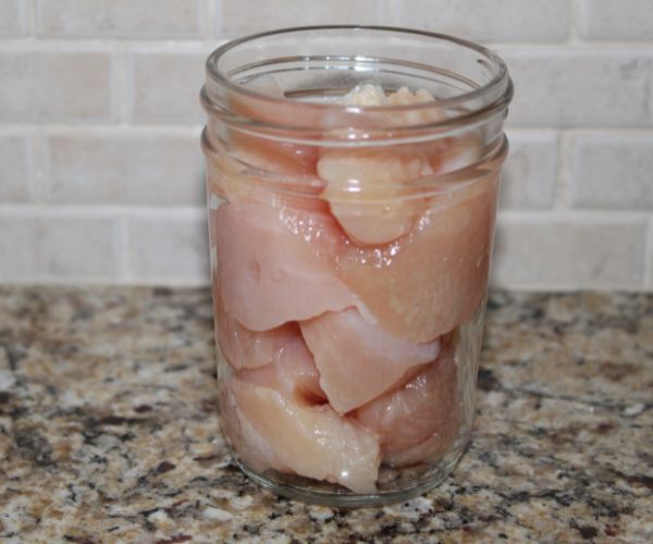 Raw chicken in a jar