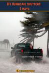 truck driving through heavy rain, palm trees blowing in very strong winds
